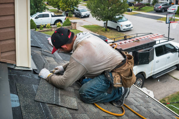 Professional Roofing technician working in Warfield, VA